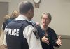 Peterborough Police Service Staff Sergeant Mark Reesor listens to an Ashburnham Ward resident following a public meeting on community safety at the Peterborough Lions Community Centre in East City on September 11, 2024. (Photo: Paul Rellinger / kawarthaNOW)