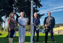 From right to left: Bancroft resident and Canadian Peace Museum founder Chris Houston, Bancroft mayor Paul Jenkins, Reverend Svinda Heinrichs of St Paul's United Church, and Bancroft general manager Andra Kauffeldt celebrated the unveiling of a peace pole in Cenotaph Park on September 20, 2024, the day before International Day of Peace. Funded by the Town of Bancroft, the peace pole is a monument that displays the message "May Peace Prevail on Earth" in eight languages, including English, French, and Algonquin. (Photo courtesy of Chris Houston)