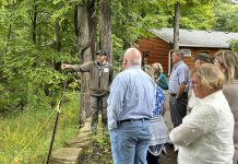 Camp Kawartha property manager Mike Schmor explains how the non-profit educational organization's new environmentally friendly septic system works during an informational tour at the organization's Douro-Dummer location on September 10, 2024, attended by Peterborough-Kawartha MPP Dave Smith and representatives from donor organizations including Ontario Trillium Foundation and Williams Wilson Sherport Foundation. The septic system uses the patented Waterloo Biofilter system originally developed at the University of Waterloo. (Photo courtesy of Camp Kawartha)