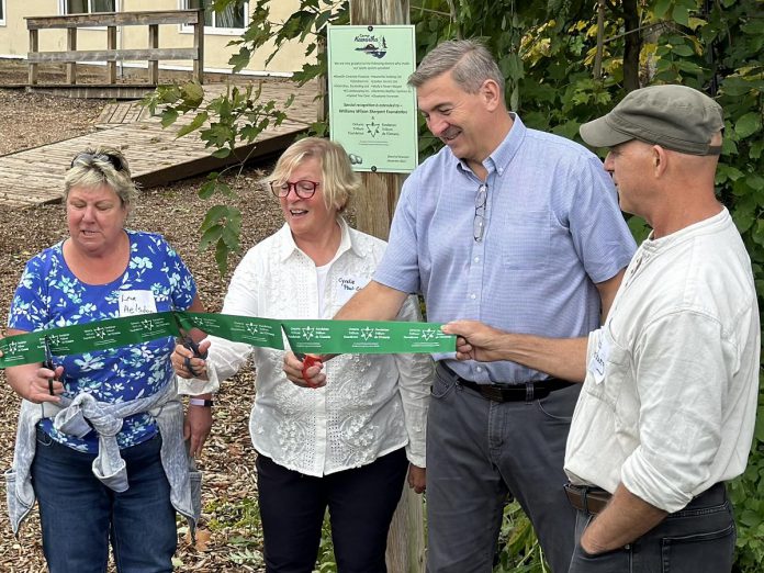 An official ribbon-cutting ceremony was held at Camp Kawartha in Douro-Dummer on September 10, 2024 for the unveiling of the non-profit educational organization's new environmentally friendly septic system, funded by a $150,000 grant from the Ontario Trillium Foundation as well as additional funding from other donors. Pictured from left to right are Lisa Helsdon of Williams Wilson Sherport Foundation, Cyndie Paul-Girdwood of Ontario Trillium Foundation, Peterborough-Kawartha MPP Dave Smith, and Camp Kawartha executive director Jacob Rodenburg, (Photo courtesy of Camp Kawartha)