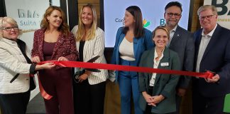 Community Futures Peterborough officially launched the revamped Business Advisory Centre with a ribbon-cutting ceremony at Venture North in downtown Peterborough on September 9, 2024. Pictured from left to right are Peterborough County warden Bonnie Clark, Peterborough-Kawartha MP Michelle Ferreri, Community Futures Peterborough executive director Devon Girard, Business Advisory Centre manager Rosalea Terry, business advisor Lindsay Irwin, Peterborough city councillor Don Vassiliadis, and Community Futures Peterborough board chair Wayne Harding. (Photo: Jeannine Taylor / kawarthaNOW)