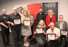 The graduates of Community Futures Peterborough's 2024 ScaleUP program, presented in partnership with Scotiabank, were celebrated during an event on September 17, 2024 at Venture North in downtown Peterborough. Pictured from left to right, front and back: Braden Clark of Community Futures Peterborough, Clint Clarke of Barking Pixel Design Co., Tracy Cosburn of Kyoto Coffee, Alicia Doris of Living Local Marketplace, Jacob Rodenburg of Camp Kawartha, Sean Flanagan of Flanagan and Sun, Peterborough city councillor Don Vassiliadis, Diane Richard of Diatom Consulting, Kevin Miller of Scotiabank, and Peterborough County warden Bonnie Clark. (Photo: Jeannine Taylor / kawarthaNOW)