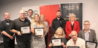 The graduates of Community Futures Peterborough's 2024 ScaleUP program, presented in partnership with Scotiabank, were celebrated during an event on September 17, 2024 at Venture North in downtown Peterborough. Pictured from left to right, front and back: Braden Clark of Community Futures Peterborough, Clint Clarke of Barking Pixel Design Co., Tracy Cosburn of Kyoto Coffee, Alicia Doris of Living Local Marketplace, Jacob Rodenburg of Camp Kawartha, Sean Flanagan of Flanagan and Sun, Peterborough city councillor Don Vassiliadis, Diane Richard of Diatom Consulting, Kevin Miller of Scotiabank, and Peterborough County warden Bonnie Clark. (Photo: Jeannine Taylor / kawarthaNOW)