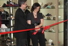 Grady's Feet Essentials owners Tony and Kelli Grady in 2012, cutting the ribbon during a grand opening of their former location in Peterborough's Lansdowne Place Mall following a major storefront renovation. Now located again in downtown Peterborough and celebrating 40 years in business, the couple reflects on the ups and downs of running their successful business. (Photo courtesy of Grady's Feet Essentials)