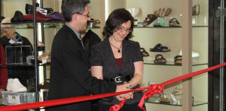 Grady's Feet Essentials owners Tony and Kelli Grady in 2012, cutting the ribbon during a grand opening of their former location in Peterborough's Lansdowne Place Mall following a major storefront renovation. Now located again in downtown Peterborough and celebrating 40 years in business, the couple reflects on the ups and downs of running their successful business. (Photo courtesy of Grady's Feet Essentials)