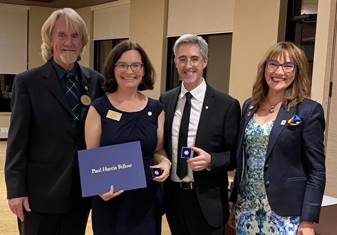 Rotarian Lloyd Graham (left) and Rotary District 7010 Governor Juanita Hodgson (right) presented Kelli and Tony Grady with the Rotary Club of Peterborough's Paul Harris Fellow Award in November 2023. Nominated by Graham, the couple received the Club Service award which recognizes outstanding contributions of Rotarians. (Photo courtesy of Grady's Feet Essentials)