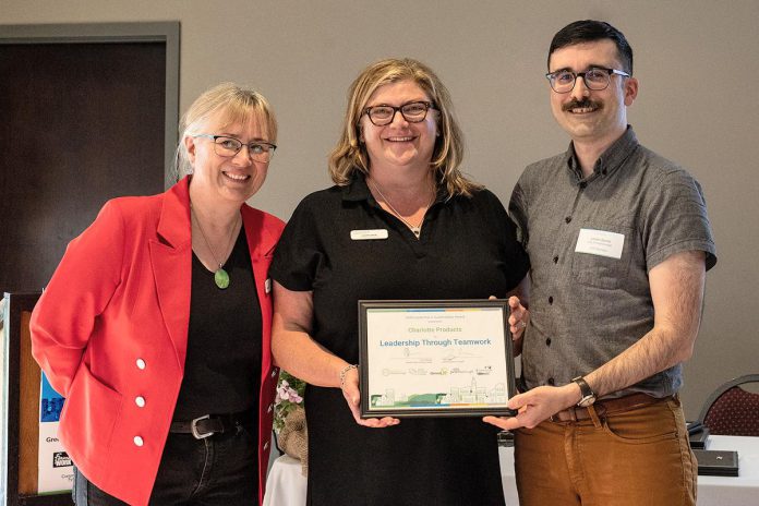 Jennifer Meek (middle) accepts the Leadership Through Teamwork award on behalf of Charlotte Products at the Leadership in Sustainability Awards in April 2024. Meek is pictured with Green Economy Peterborough hub coordinator Jackie Donaldson and City of Peterborough climate change manager James Byrne. (Photo: Heather Doughty)