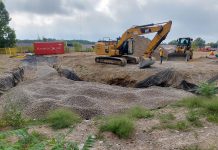 In the past, developers have accomplished stormwater management requirements by building stormwater ponds that require a great deal of concrete and gravel fill. The new Peterborough Fire Hall on Marina Boulevard will feature some on-site stormwater management features. Pictured under construction is a bioretention cell, which is a shallow stormwater basin that uses engineered soils and vegetation to capture and treat runoff. (Photo: Dylan Radcliffe)