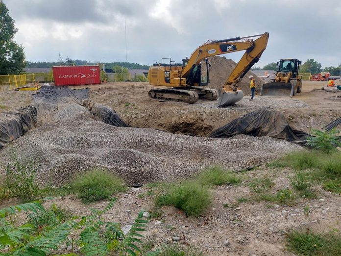 In the past, developers have accomplished stormwater management requirements by building stormwater ponds that require a great deal of concrete and gravel fill. The new Peterborough Fire Hall on Marina Boulevard will feature some on-site stormwater management features. Pictured under construction is a bioretention cell, which is a shallow stormwater basin that uses engineered soils and vegetation to capture and treat runoff. (Photo: Dylan Radcliffe)