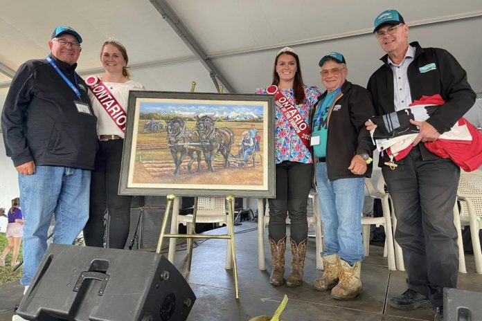 Each year, the International Plowing Match and Rural Expo (IPM) features the Queen of the Furrow Competition, where young women in agriculture compete to be the provincial ambassador. Pictured is the 2023 Ontario Queen of the Furrow Mel Karpenko (Peel Dufferin Plowmen's Association) and 2022 Ontario Queen of the Furrow Maranda Klaver (Huron County Plowmen's Association) with 2024 IPM Local Organizing Committee members Bob Armstrong, Gord Masters, and Ron Ashmore. (Photo courtesy of IPM)