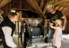 A young girl gets some help pressing apples for cider 19th-century style at the 2023 Applefest at Lang Pioneer Village Museum in Keene. The popular annual family event returns for 2024 on Sunday, October 7. (Photo: Heather Doughty Photography)