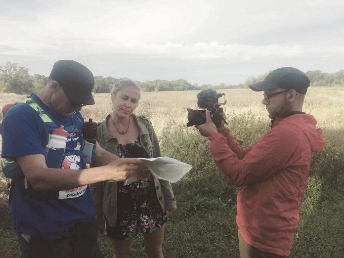 Rodney Fuentes (right) filming Clay Williams and Carlotta James near Tucumseh, Michigan on the seventh day of the 47-day inaugural Monarch Ultra relay run in fall 2019 that followed the 4,300-kilometre migratory path of the monarch butterfly from Peterborough to Mexico. With no budget and no crew, Fuentes relied on his creative and improvisational skills to capture footage during the run for his documentary, which also includes later interviews with pollinator advocates and experts. (Photo: Monarch Ultra / Facebook)