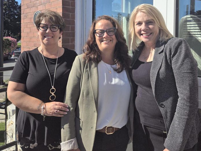 Tracie Bertrand, Rhonda Keenan, and Sarah Budd in front of Peterborough County's new economic and tourism office in the former post office at 12 Queen Street in Lakefield. Set to open soon, the office will serve as the central hub in a "hub and spoke" model that will provide services to businesses and residents across the county. (Photo: Peterborough County)