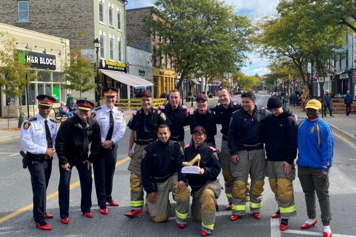 Members of the Cobourg Police Service wearing red high-heeled shoes during a past "Walk a Mile" fundraiser for Cornerstone Family Violence Prevention Centre in Cobourg. (Photo courtesy of Cornerstone Family Violence Prevention Centre)