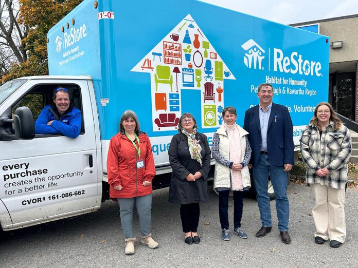 Habitat for Humanity Peterborough and Kawartha Region (Habitat PKR) unveiled its new ReStore truck on October 25, 2024 during Waste Reduction Week. The truck, which was funded through a capital grant from the provincial government's Ontario Trillium Foundation, will allow the non-profit organization to collect more donated items to be sold in its three ReStores. Pictured from left to right are Habitat PKR's procurement manager Mario Zambonin, Habitat PKR board chair Hope Lee, Habitat PKR CEO Susan Zambonin, Ontario Trillium Foundation volunteer Klara Oyler, Peterborough-Kawartha MPP Dave Smith, and Habitat PKR communications and marketing manager Holly O'Conner. (Photo courtesy of Habitat PKR)