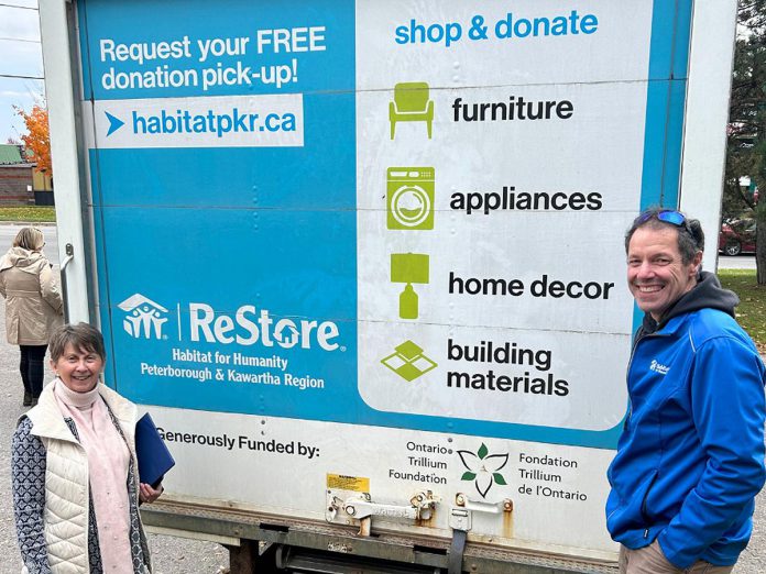 Ontario Trillium Foundation (OTF) volunteer Klara Oyler and Habitat for Humanity Peterborough and Kawartha Region (Habitat PKR) procurement manager Mario Zambonin in front of the ReStore truck funded by an OTF capital grant. The truck will be used for Habitat PKR's free pickup service for donations to the organization's ReStores in Peterborough, Lakefield, and Lindsay, which sell new and gently used building materials, furniture, and home décor.  The truck will also assist in Habitat PKR's kitchen and home deconstruction program, which offers homeowners a free removal service of kitchens and large built-in items that are then sold in ReStores. (Photo courtesy of Habitat PKR)