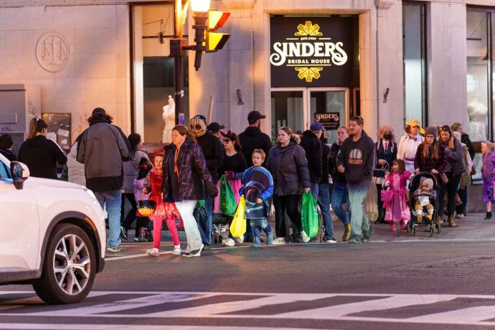 Families trick-or-treating during the second annual "Halloween in the Booro" event in 2023. Organized by the Peterborough Downtown Business Improvement Area (DBIA), the 2024 event returns to the downtown from 5 to 8 p.m. on Saturday, October 26. (Photo courtesy of Peterborough DBIA)