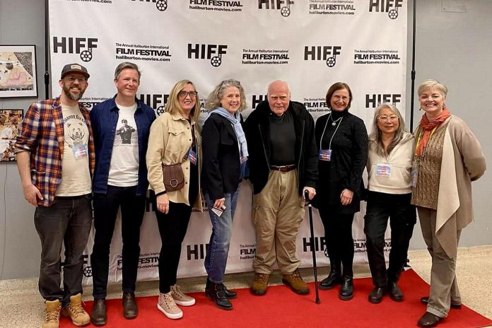 Keith Stata (with cane), the subject of the Canadian documentary film "The Movie Man" about Stata's Highlands Cinemas in Kinmount in Kawartha Lakes, with director Matt Finlan (second from left). The 2024 Haliburton International Film Festival (HIFF) runs from Friday to Sunday (November 1 to 3) at the Northern Lights Performing Arts Pavilion. (Photo courtesy of HIFF)