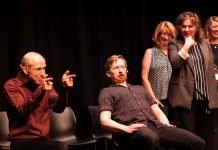 Kerry Griffin performs an unconventional kind of therapy on Mark Rostrup as Janet Van Der Graaff, Linda Kash, and Naomi Snieckus look on during klusterfork's "School's Out!" improv show at the Market Hall in July 2023. Griffin and Van Der Graaff are two of the improv professionals who will perform in klusterfork's "Impros vs. Joes" improv comedy show at the Gordon Best Theatre in downtown Peterborough on November 15, 2024, along with klusterfork's "Keep Me Up" improv workshop students. (Photo: Andy Carroll)