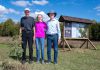 Dan Roussel, Marlene Roussel, and Mike Roussel after planting a ceremonial burr oak on September 27, 2024 to mark the opening of Kawartha Land Trust's Roussel-Steffler Memorial Forest, located within the Roussel-Steffler Memorial Sanctuary. The Roussel-Steffler family donated their 102-acre property to Kawartha Land Trust for protection in 2023 in honour of their late husband and father Paul Roussel. (Photo: Stephanie Lake for Kawartha Land Trust)