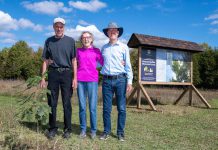 Dan Roussel, Marlene Roussel, and Mike Roussel after planting a ceremonial burr oak on September 27, 2024 to mark the opening of Kawartha Land Trust's Roussel-Steffler Memorial Forest, located within the Roussel-Steffler Memorial Sanctuary. The Roussel-Steffler family donated their 102-acre property to Kawartha Land Trust for protection in 2023 in honour of their late husband and father Paul Roussel. (Photo: Stephanie Lake for Kawartha Land Trust)