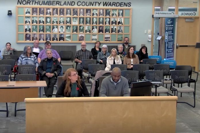 Transition House board chair Meaghan MacDonald and executive director Ike Nwibe address Northumberland County Council during a special county council meeting on October 29, 2024. With a 2024 bylaw around the regulation of emergency care establishments now in place in Cobourg, Transition House may be forced to close its doors to additional guests or reduce its occupancy at its Chapel Street location. (kawarthaNOW screenshot of Northumberland County video)