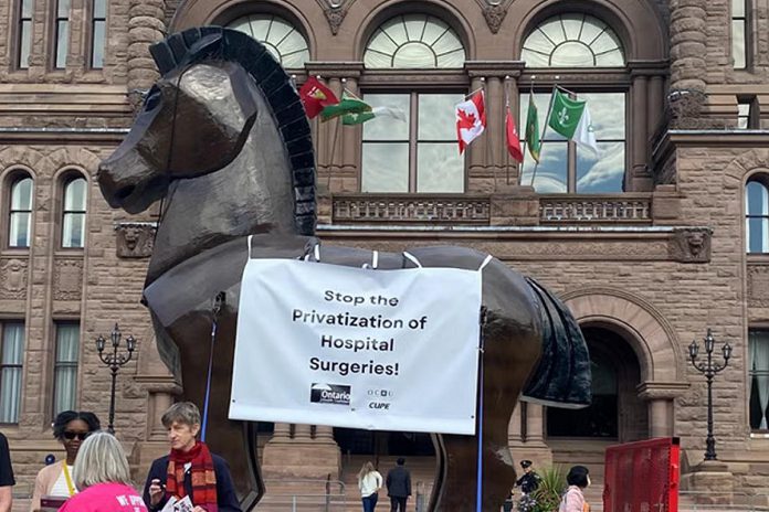 CUPE's Ontario Council of Hospital Unions (OCHU-CUPE) and the Ontario Health Coalition launched their Trojan Horse Ontario Tour to protest privatization of hospital surgeries on October 4, 2024 at Queen's Park in Toronto, and will be visiting locations around the province until the end of November. (Photo: OCHU-CUPE)