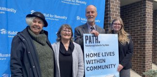 Peterborough Action for Tiny Homes (PATH) chair Trish Campbell, Habitat for Humanity Peterborough and Kawartha Region CEO Susan Zambonin, PATH land acquisition working group lead Keith Dalton, and Habitat for Humanity communications and donor services manager Jenn MacDonald outside Habitat for Humanity's Milroy Drive location on April 25, 2023, when it was announced that Habitat would lease the former Peterborough Humane Society property at 385 Lansdowne Street to PATH for a sleeping cabin community. (Photo: Paul Rellinger / kawarthaNOW)