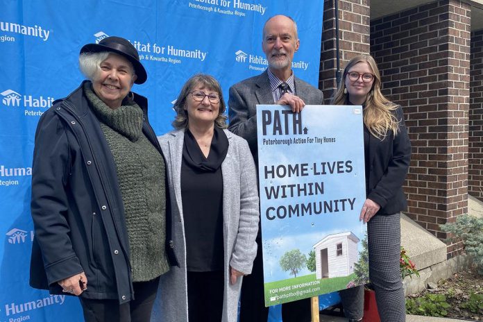 Peterborough Action for Tiny Homes (PATH) chair Trish Campbell, Habitat for Humanity Peterborough and Kawartha Region CEO Susan Zambonin, PATH land acquisition working group lead Keith Dalton, and Habitat for Humanity communications and donor services manager Jenn MacDonald outside Habitat for Humanity's Milroy Drive location on April 25, 2023, when it was announced that Habitat would lease the former Peterborough Humane Society property at 385 Lansdowne Street to PATH for a sleeping cabin community. (Photo: Paul Rellinger / kawarthaNOW)