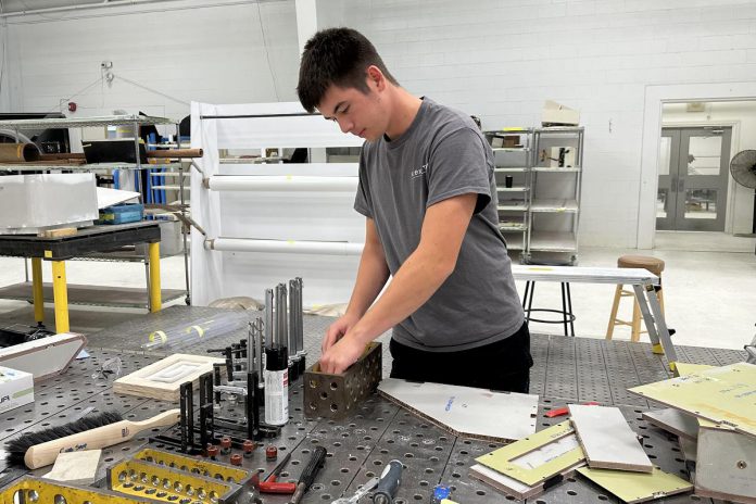 Flying Colours Corp. at the Peterborough Airport was one of the 35 employers who hired high school students under the Build & Soar Program. Flying Colours specializes in maintaining, refurbishing, and overhauling (MRO) business jets, including repairing, restoring and upgrading cabinetry and soft furnishings, cabin installation, and quality paint finishing. (Photo courtesy of Peterborough & the Kawarthas Economic Development)