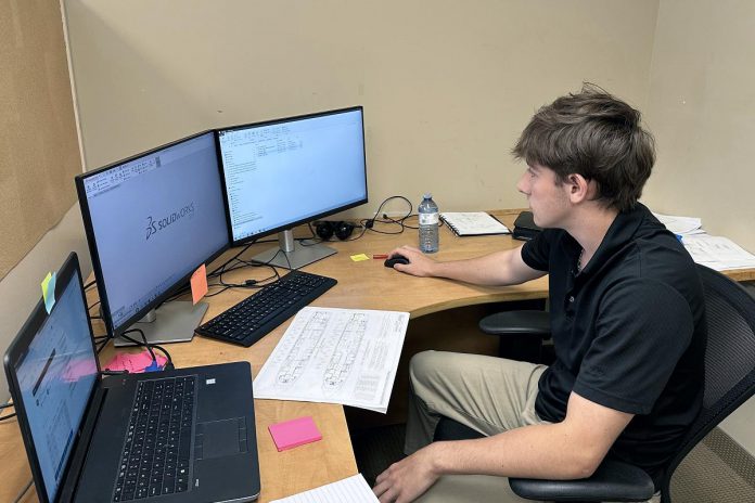 A high school student on the job at Flying Colours Corp. at the Peterborough Airport as part of the Build & Soar Program. Job opportunities for students participating in the aerospace and aviation sector ranged from airport administration, aircraft component manufacturing, electronics, aviation development, aircraft maintenance, repair and overhaul, and piloting. (Photo courtesy of Peterborough & the Kawarthas Economic Development)