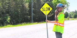 A road construction worker in Peterborough County. (kawarthaNOW screenshot of Peterborough County video)