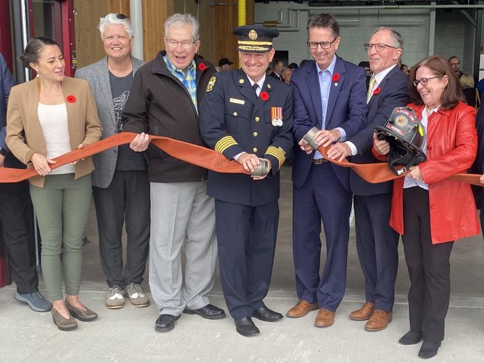 Pictured at the official hose-uncoupling ceremony of Peterborough Fire Station No. 2 at 100 Marina Boulevard on October 31, 2024 are (left to right) former Peterborough mayor Diane Therrien, city councillor Joy Lachica, Mayor Jeff Leal, Peterborough Fire Services chief Chris Snetsinger, and councillors Andrew Beamer, Dave Haake, and Lesley Parnell. Also participating but not pictured are councillors Gary Baldwin and Kevin Duguay. (Photo: Paul Rellinger / kawarthaNOW)