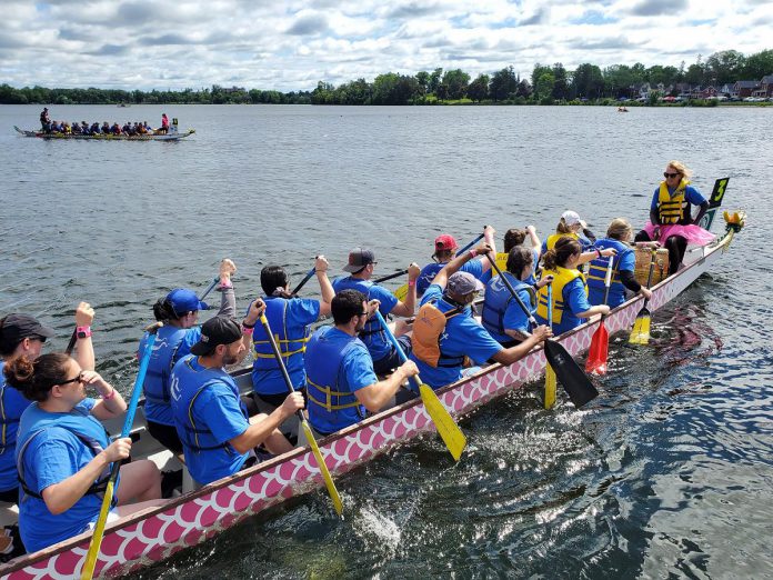 Jennie Ireland drumming for the Peterborough Regional Health Centre (PRHC) Foundation's team during Peterborough's Dragon Boat Festival. As a PRHC Foundation ambassador, Ireland regularly shares her story as a breast cancer survivor who received the treatment she needed close to home at PRHC. Sharing a story of receiving great care at PRHC is just one of the ways to support the PRHC Foundation's $60 million Campaign for PRHC. (Photo courtesy of PRHC Foundation)  