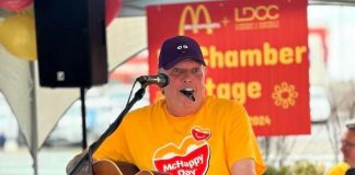 Lindsay & District Chamber of Commerce executive director Terry Guiel performing on the "McChamber Stage" in support of the McDonalds restaurant in Lindsay during McHappy Day on May 8, 2024. Over the past year, the Peterborough resident has embraced his role as champion of the chamber's 275-plus members, meeting with local businesses and increasing the membership by 25 per cent, generating $80,000 in grants and sponsorships, and making the chamber more visible in the community. (Photo courtesy of Terry Guiel)