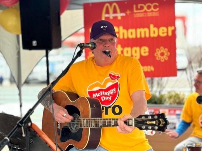 Lindsay & District Chamber of Commerce executive director Terry Guiel performing on the "McChamber Stage" in support of the McDonalds restaurant in Lindsay during McHappy Day on May 8, 2024. Over the past year, the Peterborough resident has embraced his role as champion of the chamber's 275-plus members, meeting with local businesses and increasing the membership by 25 per cent, generating $80,000 in grants and sponsorships, and making the chamber more visible in the community. (Photo courtesy of Terry Guiel)