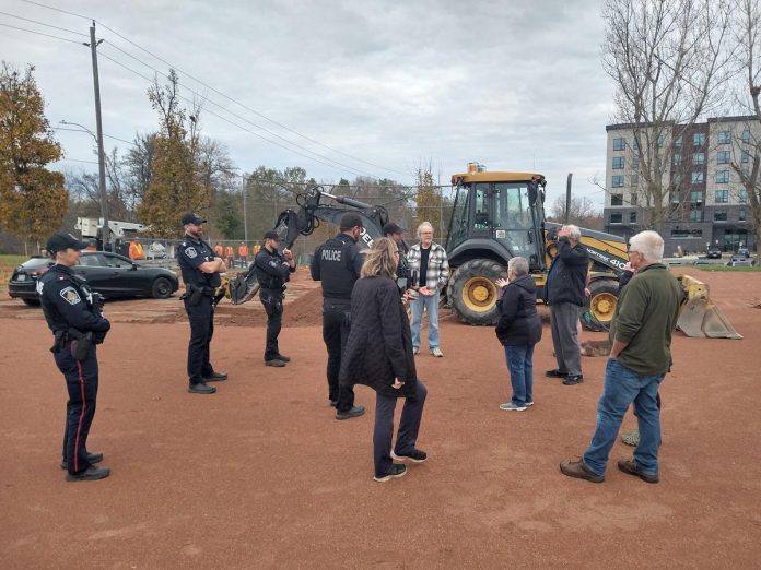 Police officers were on hand after upset residents confronted workers at Bonnerworth Park in Peterborough on November 6, 2024 as heavy machinery began preparatory work for the city's $4.4 million redevelopment of the greenspace, which would see the installation of an expanded skateboard park, a new bike pump track, and 14 pickleball courts. (Photo: Taras Pater)