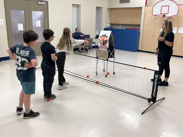 Pro pickleball player Jennie Davis gets assistance from her homemade friend Ernie to help participants in the Pickleball for All program at Five Counties Children's Centre in November improve their accuracy with the ball. (Photo courtesy of Five Counties Children's Centre)