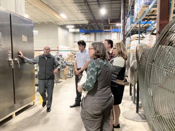 An energy-focused walkthrough with key staff can help identify some low-hanging fruit for efficiency improvements. It can also be a great way to engage with leadership. This photo features an energy walkabout at Charlotte Products, a member of Green Economy Peterborough, a GreenUP program which supports businesses to measure and reduce their environmental impact. (Photo: Jackie Donaldson)