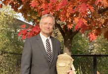 John Cunningham, president and managing director of Ashburnham Funeral Home, holds a biodegradable wicker urn. Other options available for those seeking eco-friendly end-of-life services include aquamation, basic wooden or cardboard caskets, and low-impact burials. (Photo: Jackie Donaldson)