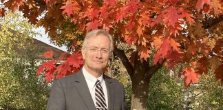 John Cunningham, president and managing director of Ashburnham Funeral Home, holds a biodegradable wicker urn. Other options available for those seeking eco-friendly end-of-life services include aquamation, basic wooden or cardboard caskets, and low-impact burials. (Photo: Jackie Donaldson)