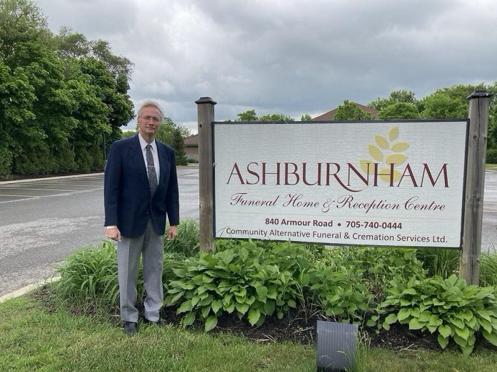 John Cunningham outside of Ashburnham Funeral Home, where he is president and managing director. Cunningham is also owner of Kawartha Aquamation, a lead member of GreenUP's Green Economy Peterborough program, a designation through which his business has committed to energy and waste reduction. (Photo: Jackie Donaldson)