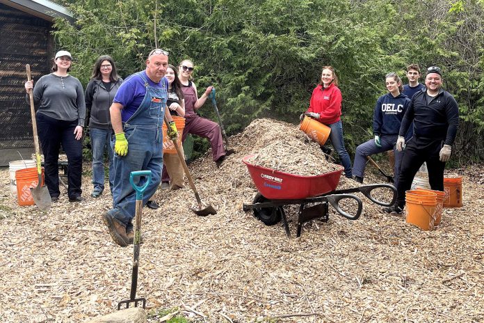 GreenUP Ecology Park director Vern Bastable works with Trent University teacher candidates to mulch pathways in the new native plant propagation area at the park earlier in 2024. This new program resulted in the propagation of 2,500 native plants. The students were part of Trent Learning Garden, an immersive placement available to teacher candidates who are interested in environmental education and sustainability. GreenUP Ecology Park remains central to GreenUP's mission, contributing to local biodiversity and community education. (Photo: Jessica Todd / GreenUP).