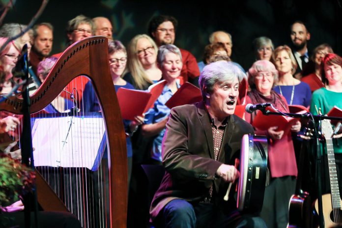 Rob Fortin performing on the bodhrán (Irish drum) at the 2015 In From The Cold at Market Hall Performing Arts Centre in downtown Peterborough. The annual benefit concert for YES Shelter for Youth and Families features Christmas carols and seasonal folk songs from around the world, all presented in a signature Celtic style. (Photo: Linda McIlwain / kawarthaNOW)