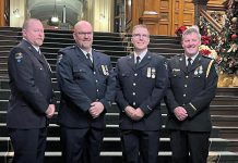 Four paramedics from Kawartha Lakes Paramedic Service were among 73 Ontario paramedics who received first, second, and third bars if the Governor General of Canada's Emergency Medical Services Exemplary Service Medal on November 20, 2024. From left to right: primary care paramedic Kevin Sheahan, advanced care paramedic Charles Phillips, advanced care and community paramedic Chris Barrow, and deputy chief and advanced care paramedic Stephen Lucas each received their second bar for 30 years of service. (Photo courtesy of City of Kawartha Lakes)