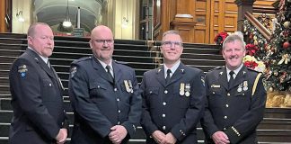 Four paramedics from Kawartha Lakes Paramedic Service were among 73 Ontario paramedics who received first, second, and third bars if the Governor General of Canada's Emergency Medical Services Exemplary Service Medal on November 20, 2024. From left to right: primary care paramedic Kevin Sheahan, advanced care paramedic Charles Phillips, advanced care and community paramedic Chris Barrow, and deputy chief and advanced care paramedic Stephen Lucas each received their second bar for 30 years of service. (Photo courtesy of City of Kawartha Lakes)