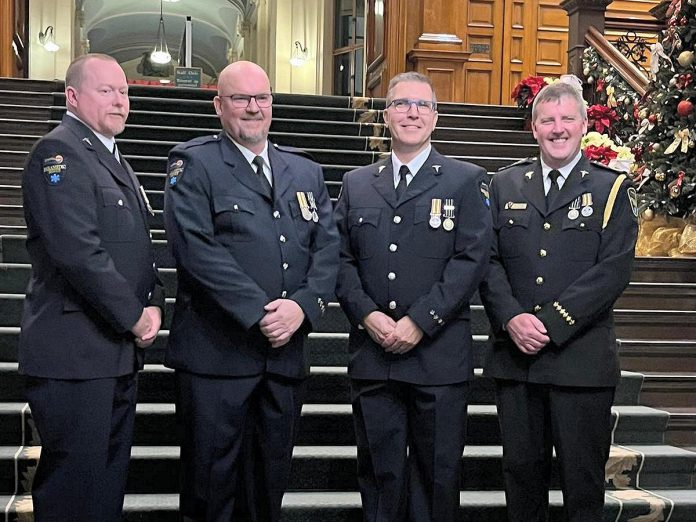 Four paramedics from Kawartha Lakes Paramedic Service were among 73 Ontario paramedics who received first, second, and third bars if the Governor General of Canada's Emergency Medical Services Exemplary Service Medal on November 20, 2024. From left to right: primary care paramedic Kevin Sheahan, advanced care paramedic Charles Phillips, advanced care and community paramedic Chris Barrow, and deputy chief and advanced care paramedic Stephen Lucas each received their second bar for 30 years of service. (Photo courtesy of City of Kawartha Lakes)