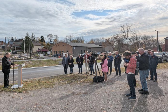 Members of the Mayor's Task Force for Housing Creation, city councillors and staff, and media at an event on November 5, 2024 in Peterborough's East City where Peterborough Mayor Jeff Leal announced the release of the task force's 15-recommendation report. (Photo: Bruce Head / kawarthaNOW)