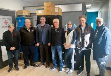 Dr. John Beamish and Dr. Yosra AlMakadma (fourth and fifth from left) are two of the physicians involved in Peterborough Street Medicine, which will receive over $1 million per year over three years to provide primary health care and mental health services to people in Peterborough who are homeless or underhoused through an alternate funding plan agreement. Also pictured from left to right are Peterborough city councillor Keith Riel, mayor Jeff Leal, Peterborough-Kawartha MPP Dave Smith, and city councillors Alex Bierk and Joy Lachica. (kawarthaNOW composite photo via Alex Bierk / Office of Dave Smith)