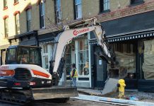 Construction crews tearing up recently poured concrete sidewalks on the south side of Walton Street in downtown Port Hope after footprints were left in the still-curing concrete, part of the Walton Street reconstruction project. The municipality says the damaged sidewalks will either be repaired or removed and repoured and fully cured in time for Port Hope's Christmas celebrations beginning November 29, 2024. (Photo: Municipality of Port Hope)